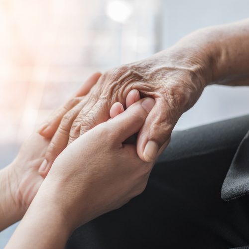 Close up of two people holding hands