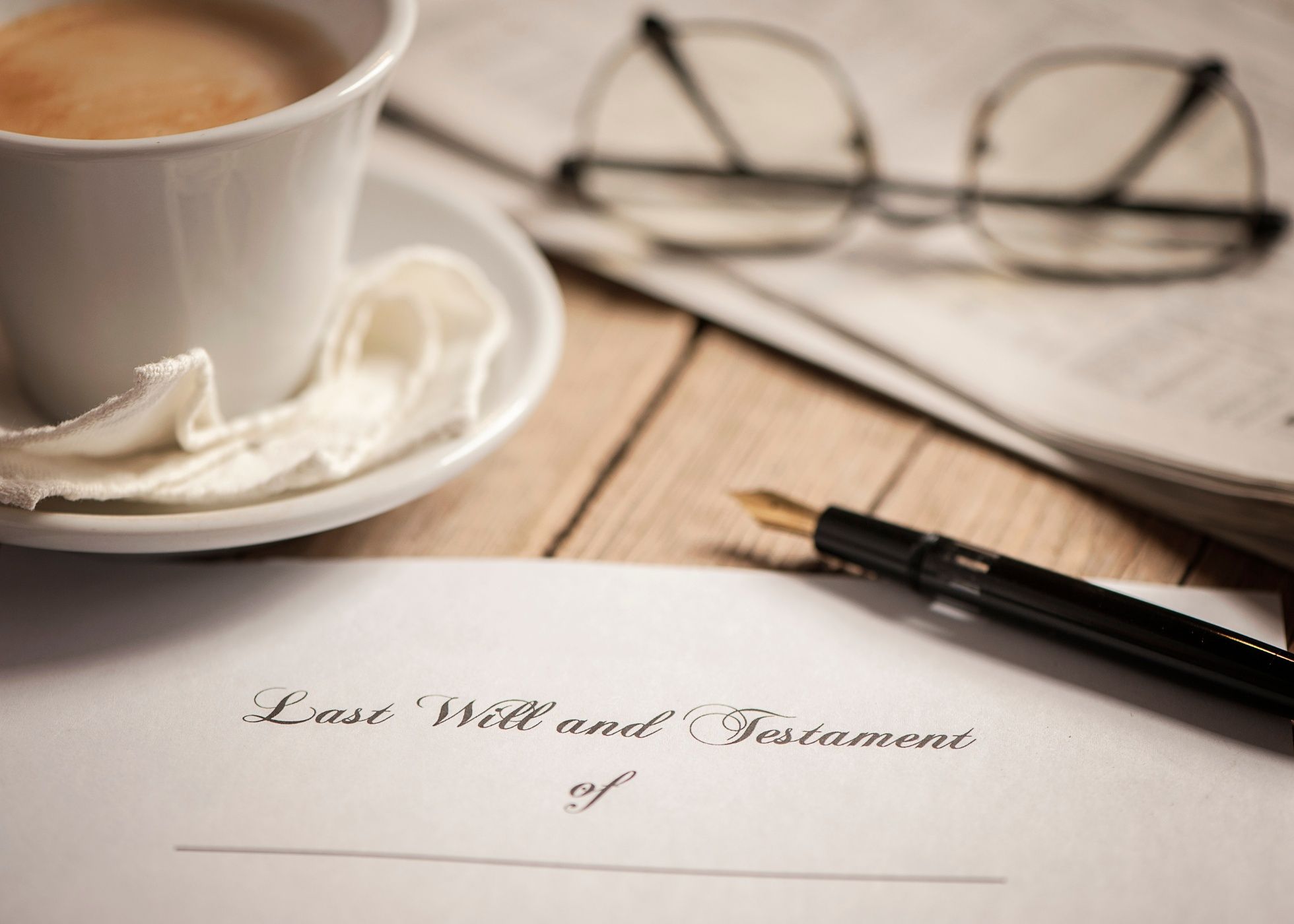 Image of Last Will and Testament with cup of coffee, glasses, and pen