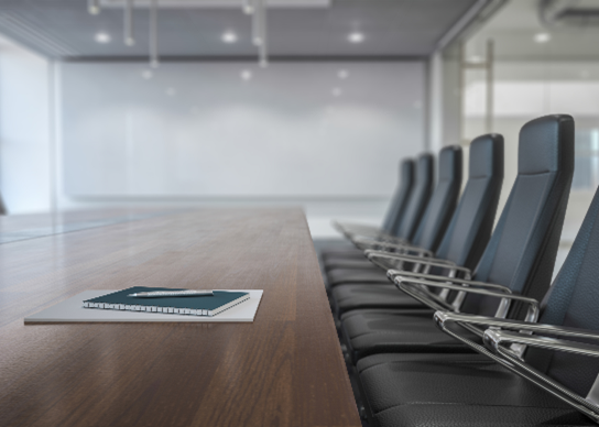 Empty meeting room with notebook on table